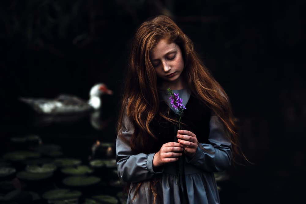 Pensive Girl With Flower by Faris Saieda — canvas wall art