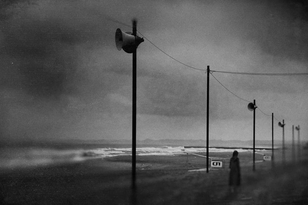 Solitary Figure Stormy Coast by Teruhiko Tsuchida — canvas wall art