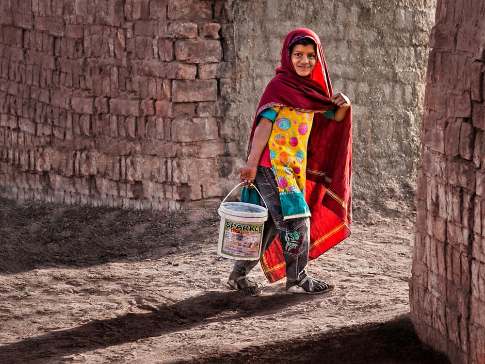 Joyful Girl With Pail by Sayyed Nayyer Reza — canvas wall art