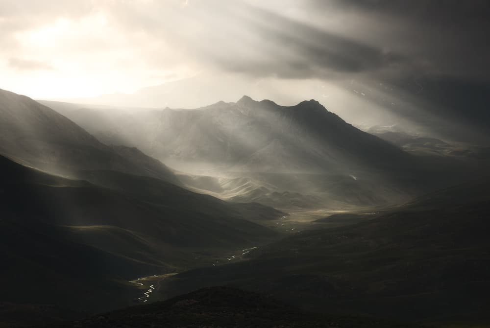 Dramatic Mountain Valley Light by Majid Behzad — canvas wall art