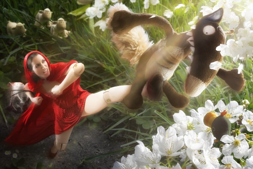 Little Red Kicks Wolf by Christophe Kiciak — canvas wall art
