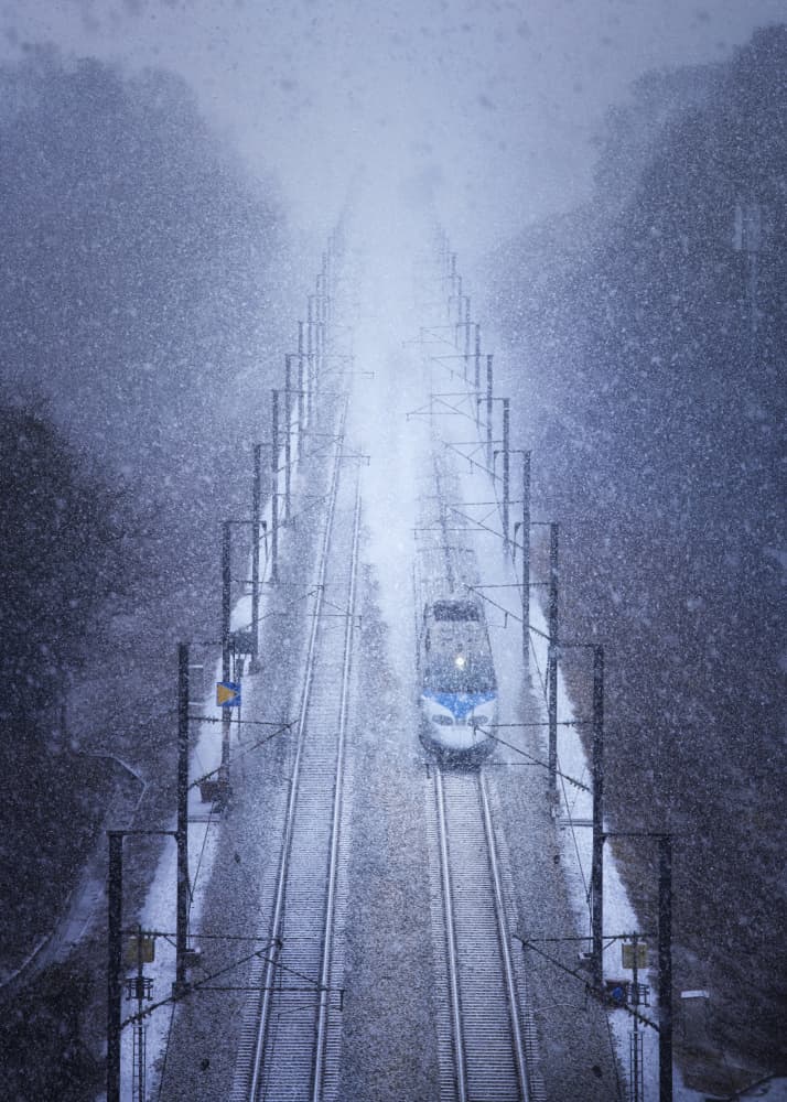 Snowy Train Journey by Tiger Seo — canvas wall art