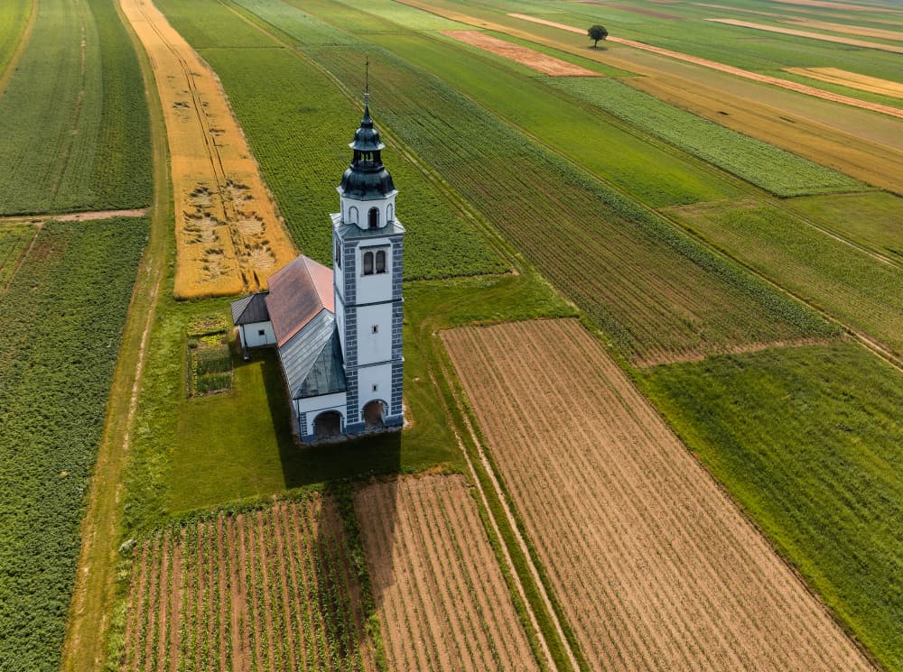 Church in Fields by Jure Kravanja — canvas wall art