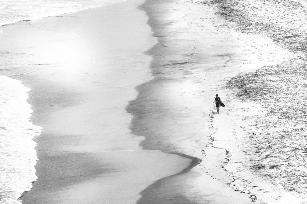Lone Surfer Beach Walk by Michel Groleau — canvas wall art