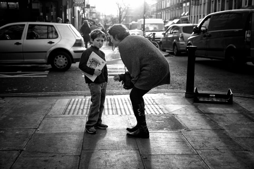 Thoughtful Boy Street Scene by Lorenzo Grifantini — canvas wall art