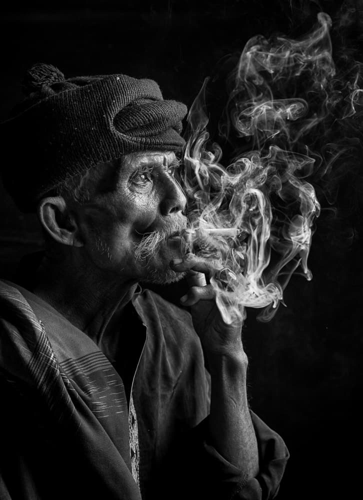 Contemplative Man Smoking by Angela Muliani Hartojo — canvas wall art