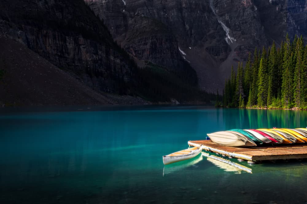 Serene Mountain Lake Canoes by Steven Zhou — canvas wall art