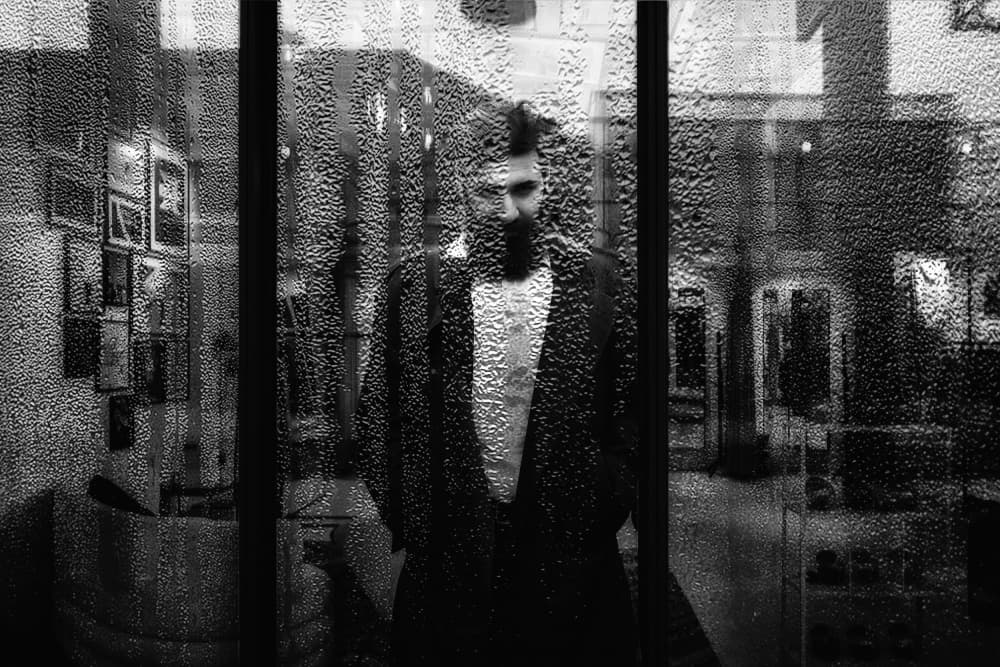 Moody Man Behind Glass by Stefan Eisele — canvas wall art