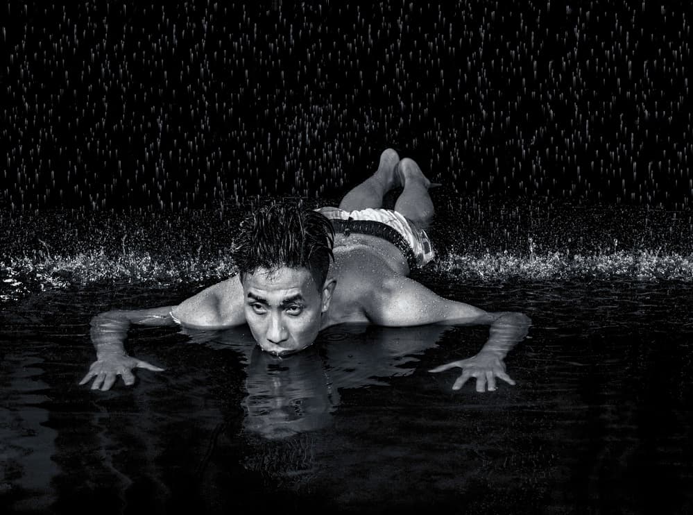 Wet Man In Rain by Luc Stalmans — canvas wall art