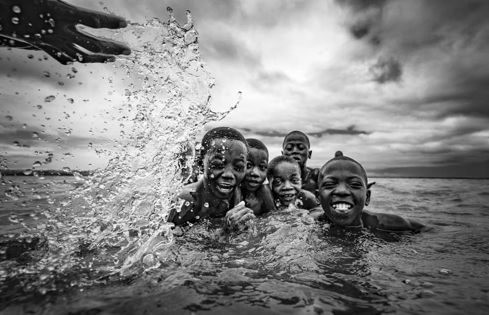 Kids Splashing Joy by João Coelho — canvas wall art