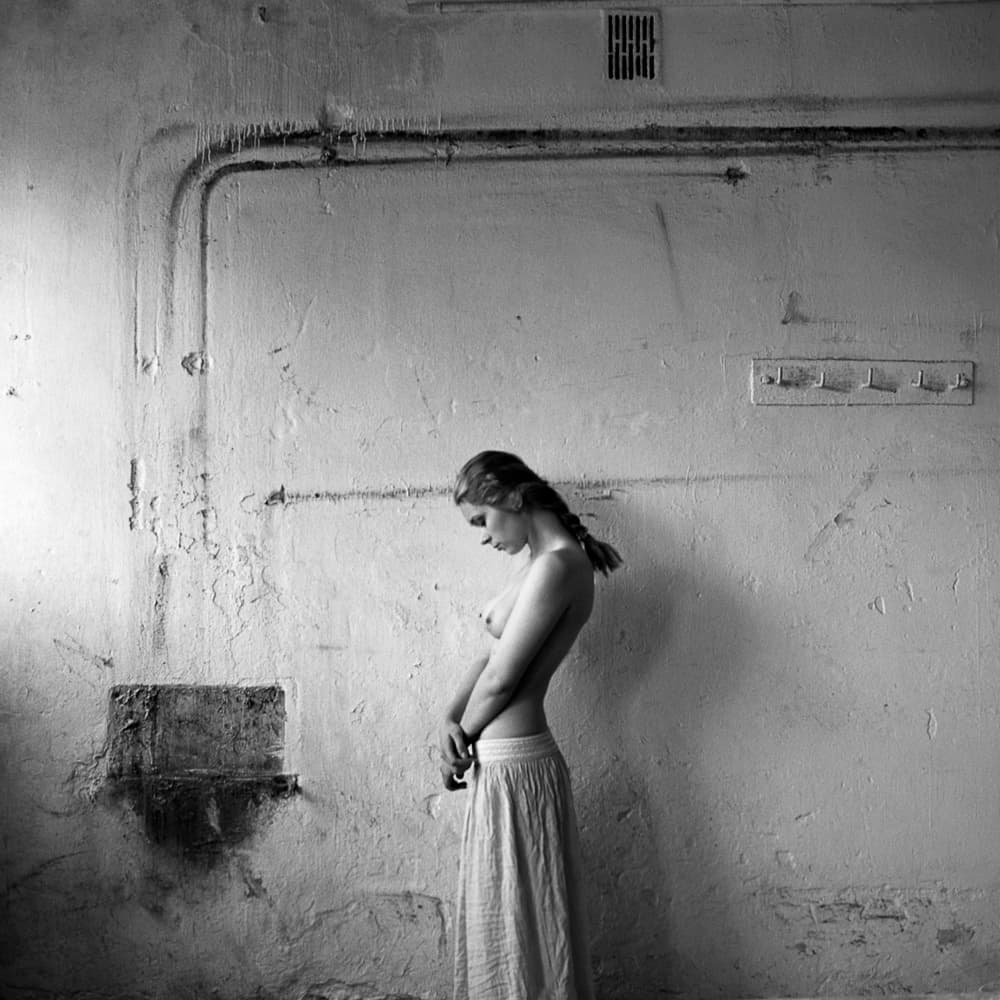 Pensive Woman Rustic Wall by Rafał Kaźmierczak — canvas wall art