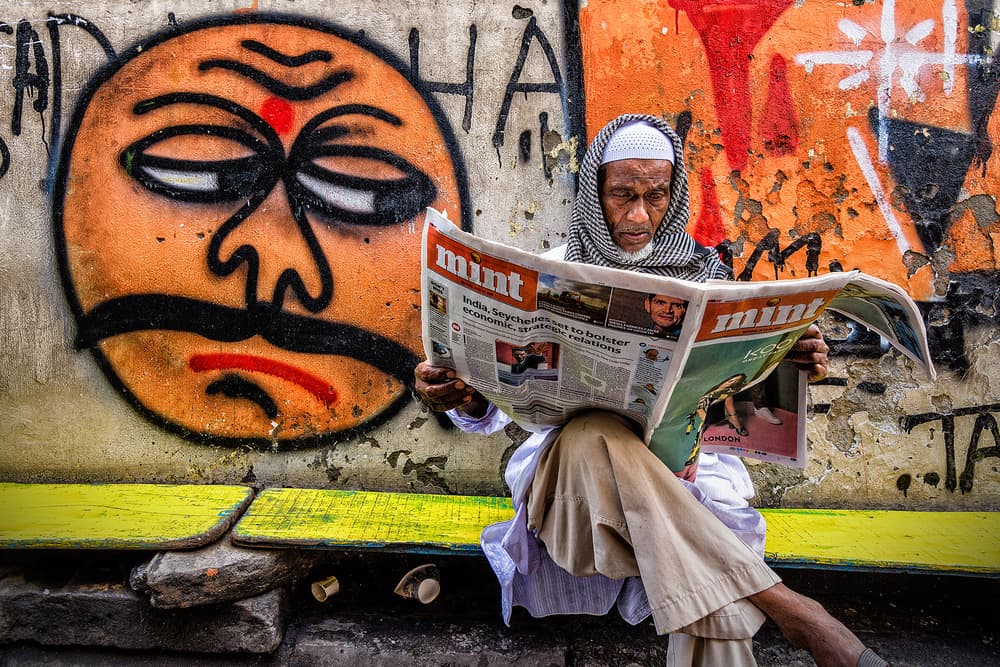 Man Reading Street Art by Saurabh Sirohiya — canvas wall art