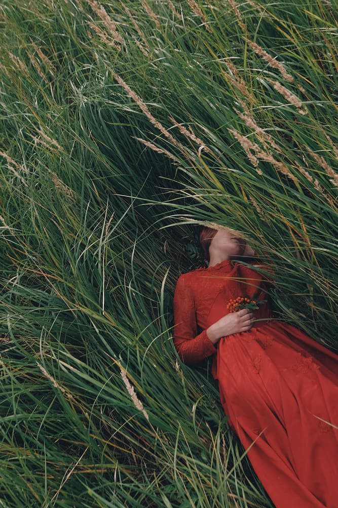 Woman in Red Meadow by Olga Barantseva — canvas wall art