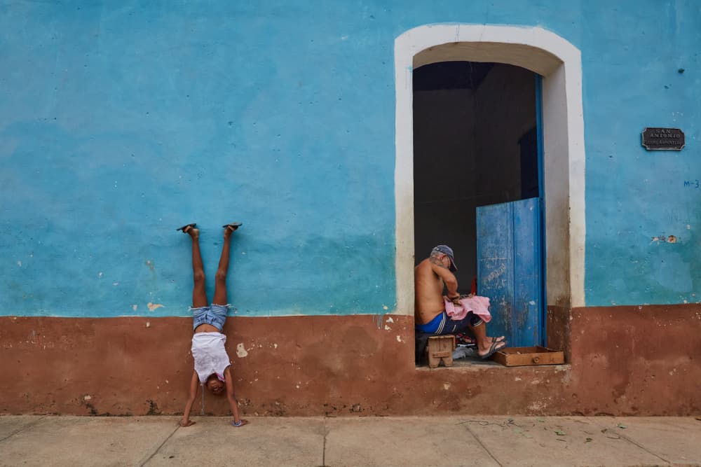 Playful Handstand Blue Wall by Avital Hershkovitz — canvas wall art