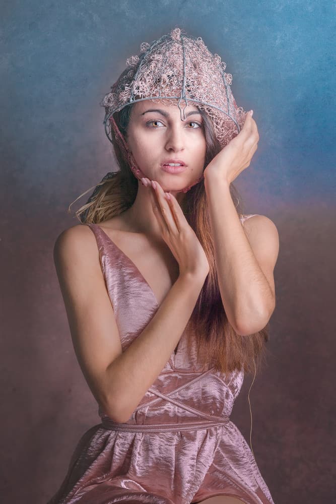 Woman in Elaborate Hat by Joan Gil Raga — canvas wall art