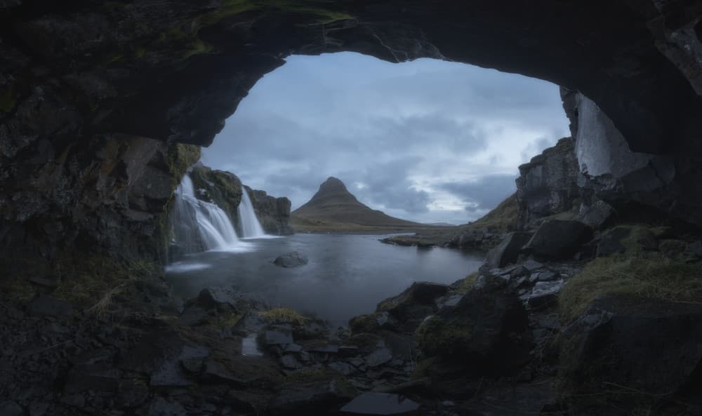 Kirkjufell Cave Waterfall by Carlos Gonzalez — canvas wall art