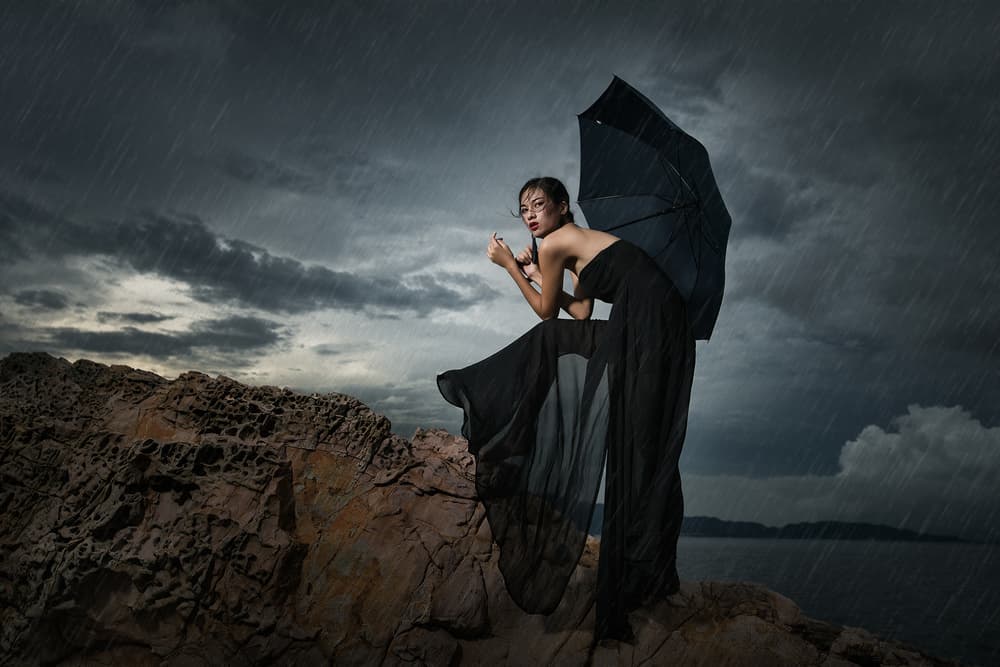Woman on Stormy Cliff by Bingo Z — canvas wall art