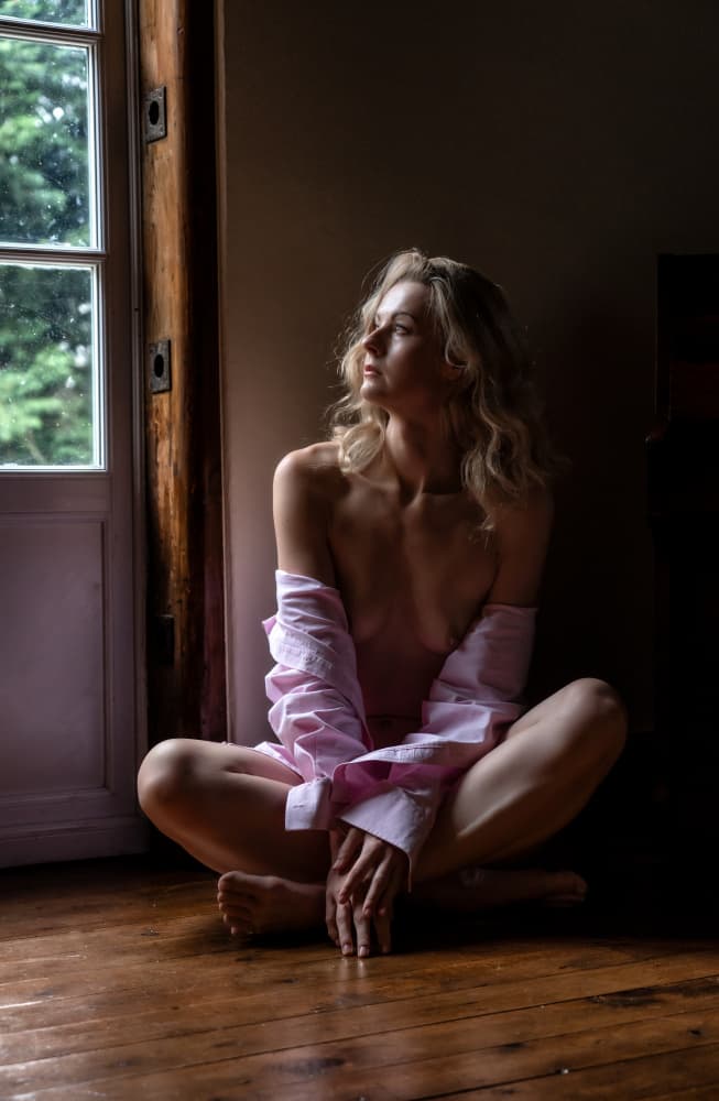 Pensive Woman by Window by Colin Dixon — canvas wall art