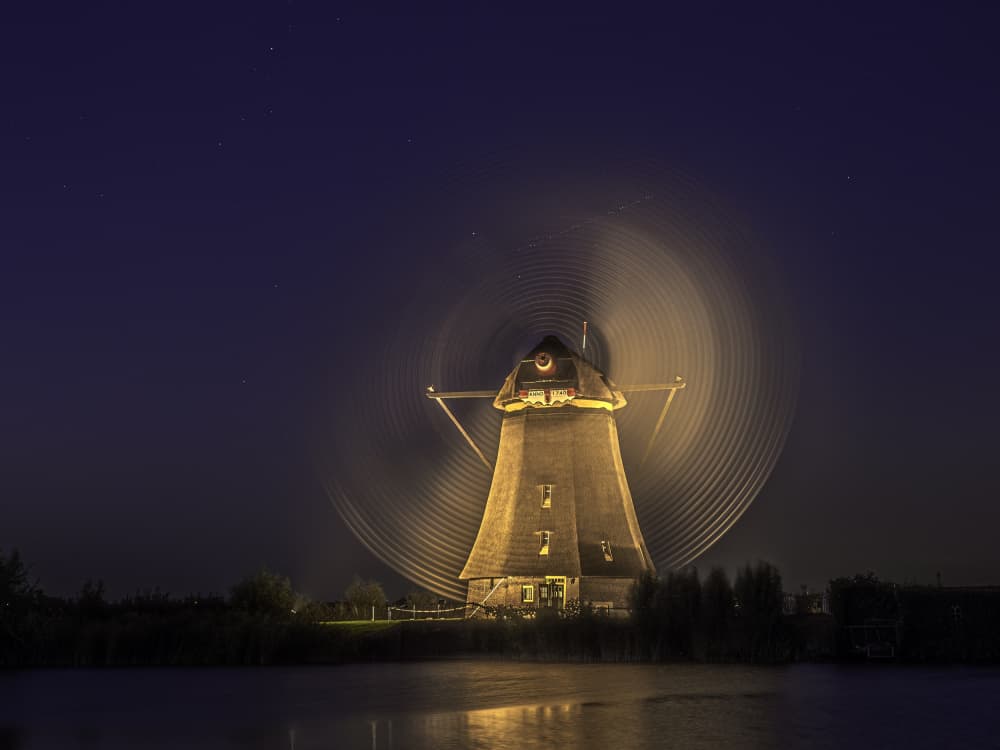 Starry Windmill Glow by Henk Goossens — canvas wall art