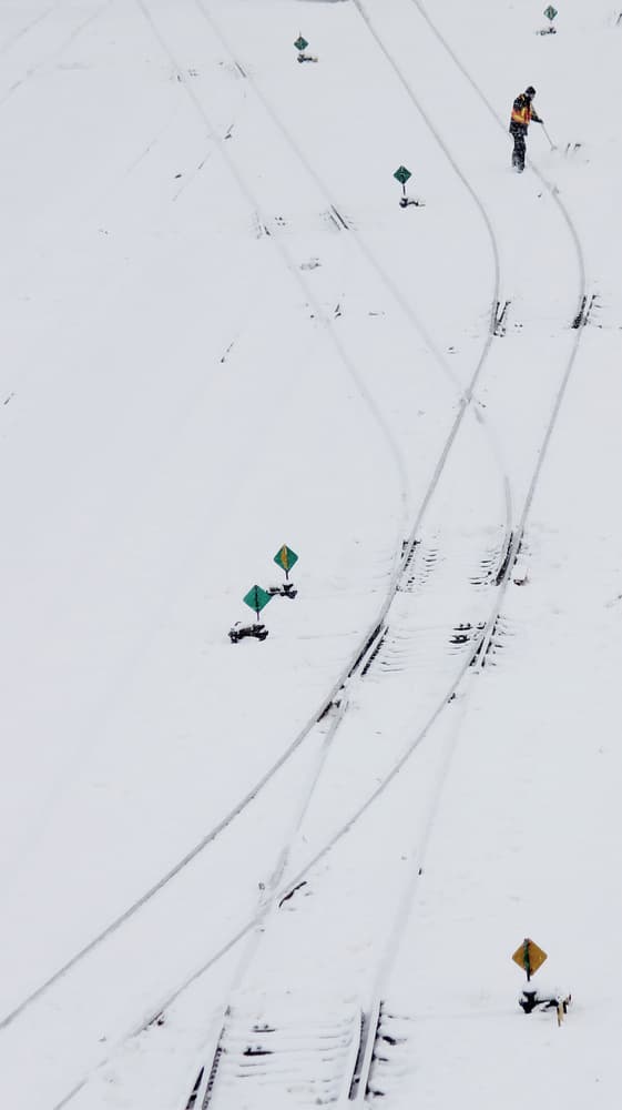 Winter Railroad Worker by Jian Wang — canvas wall art