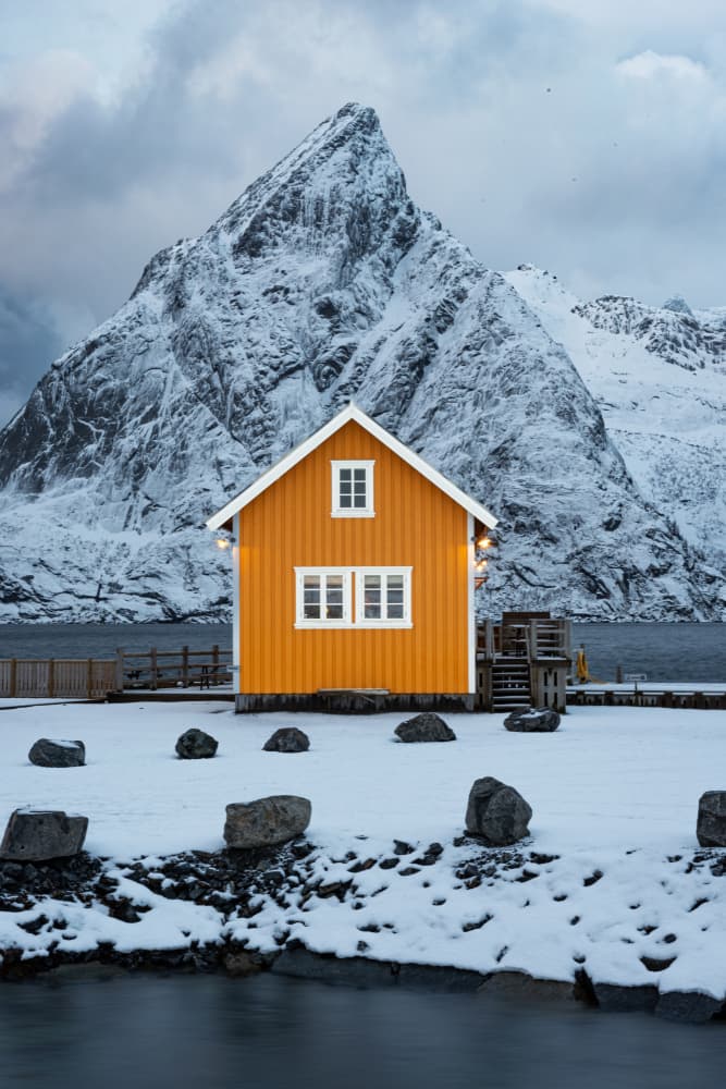 Orange House Snowy Mountain by Andrea Auf dem Brinke — canvas wall art
