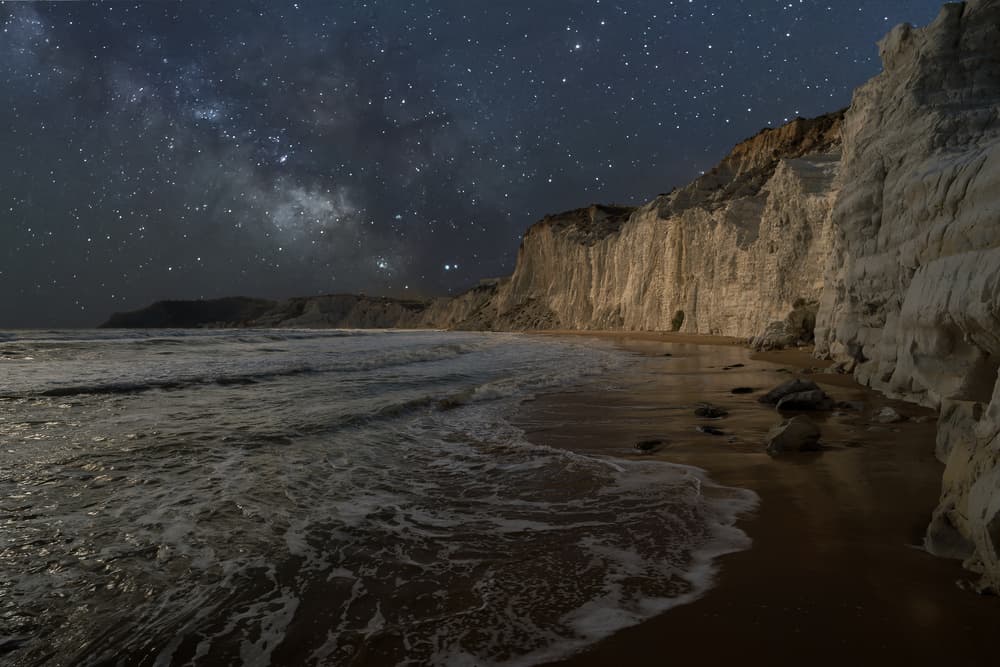Milky Way Over Cliffs by Massimo Tamajo — canvas wall art