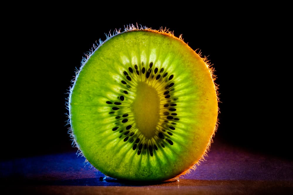 Glowing Kiwi Slice by ronaldnovianus — canvas wall art