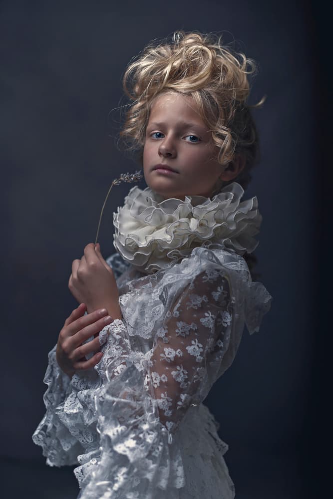 Elegant Child Holding Lavender by Ewa Cwikla — canvas wall art