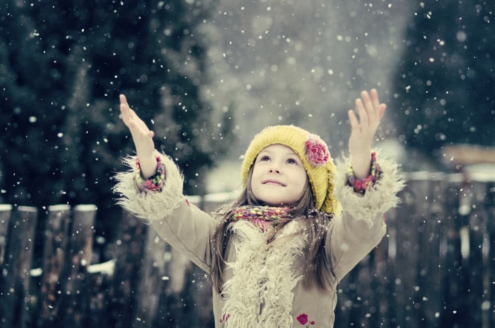 Child Catching Snow by Elena Karagyozova — canvas wall art
