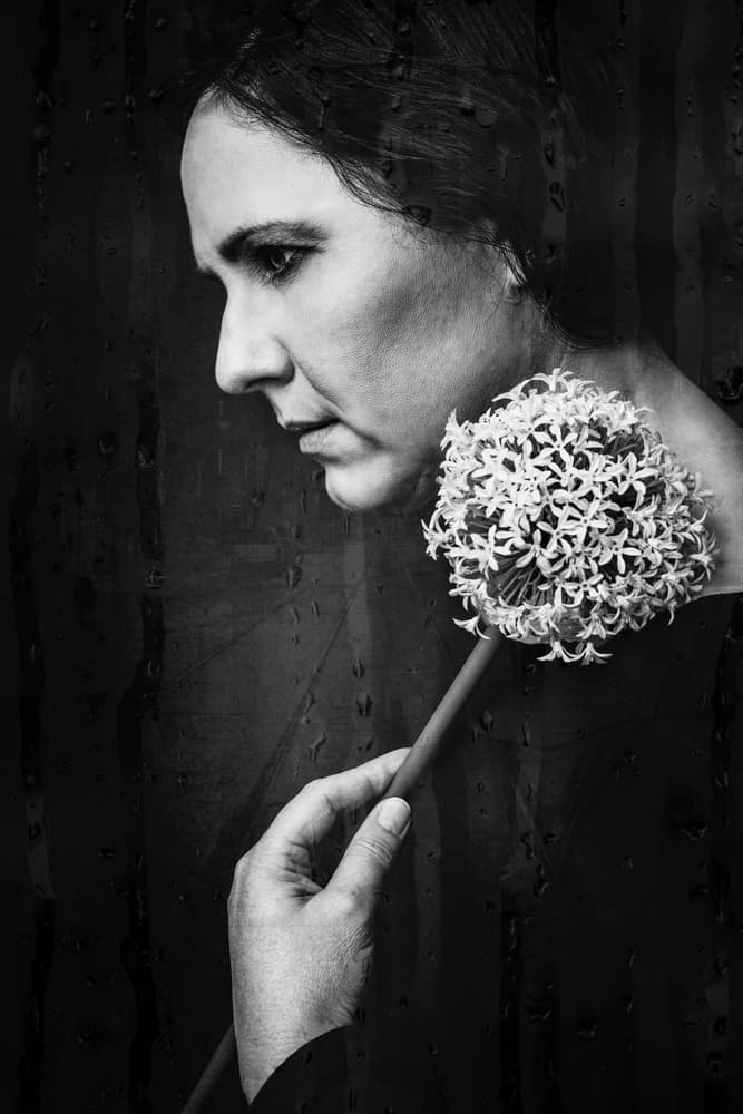 Pensive Woman with Flower by Klaus Grimm — canvas wall art