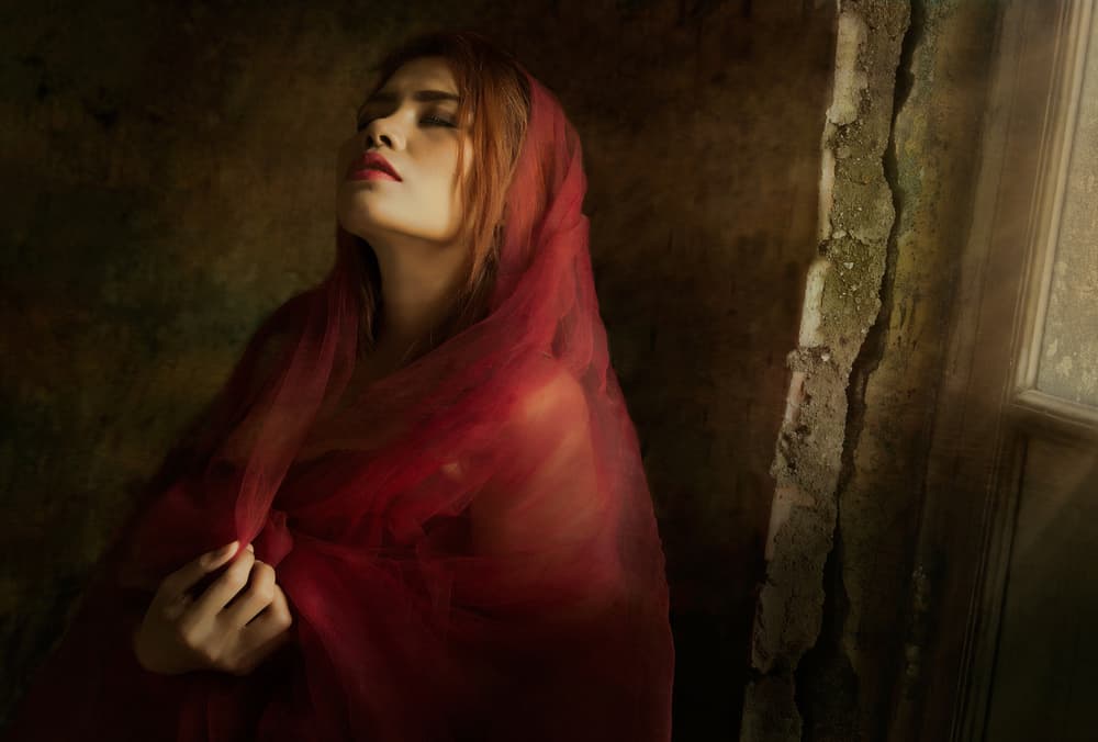 Pensive Woman Red Veil by Sebastian Kisworo — canvas wall art