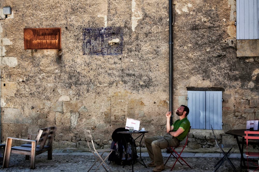 Relaxed Man Stone Wall by Yvette Depaepe — canvas wall art