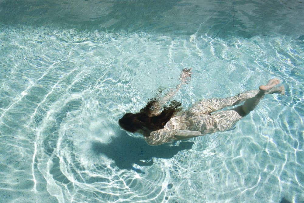 Serene Underwater Swim by Mel Brackstone — canvas wall art