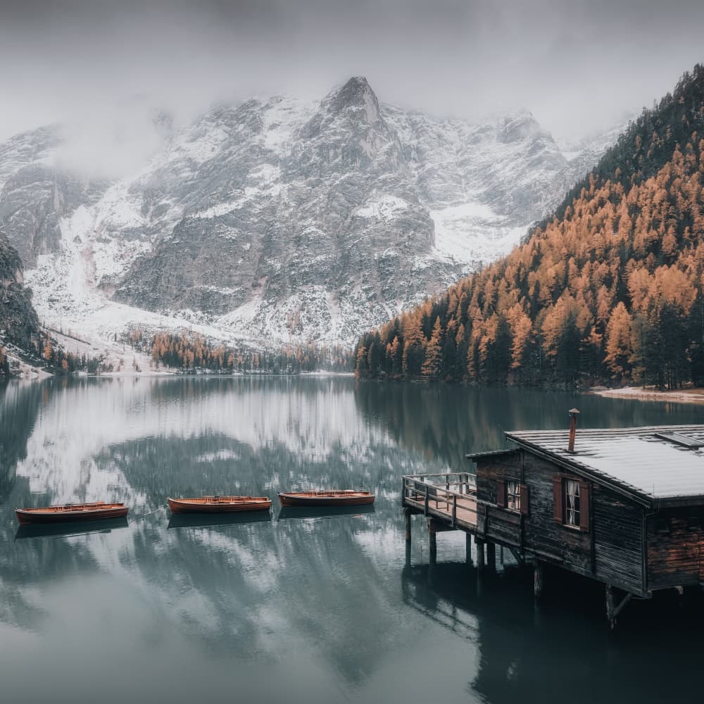 Snowy Mountain Lake Boathouse by Thomas de Franzoni — canvas wall art
