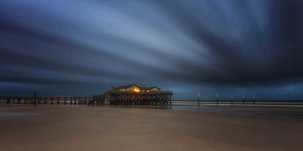 Stilt House Twilight Glow by Sven Kohnke — canvas wall art