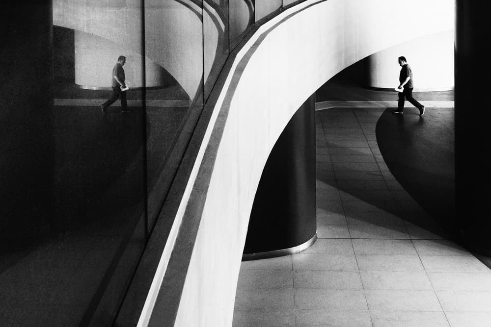 Man in Architectural Reflection by Riccardo Lucidi — canvas wall art