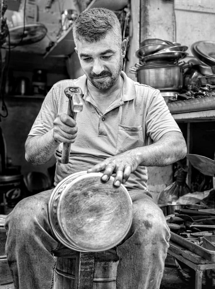 Craftsman Shaping Metal by Bashar Alsofey — canvas wall art