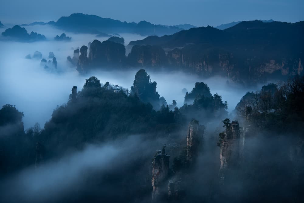 Misty Blue Hour Mountains by Simoon — canvas wall art
