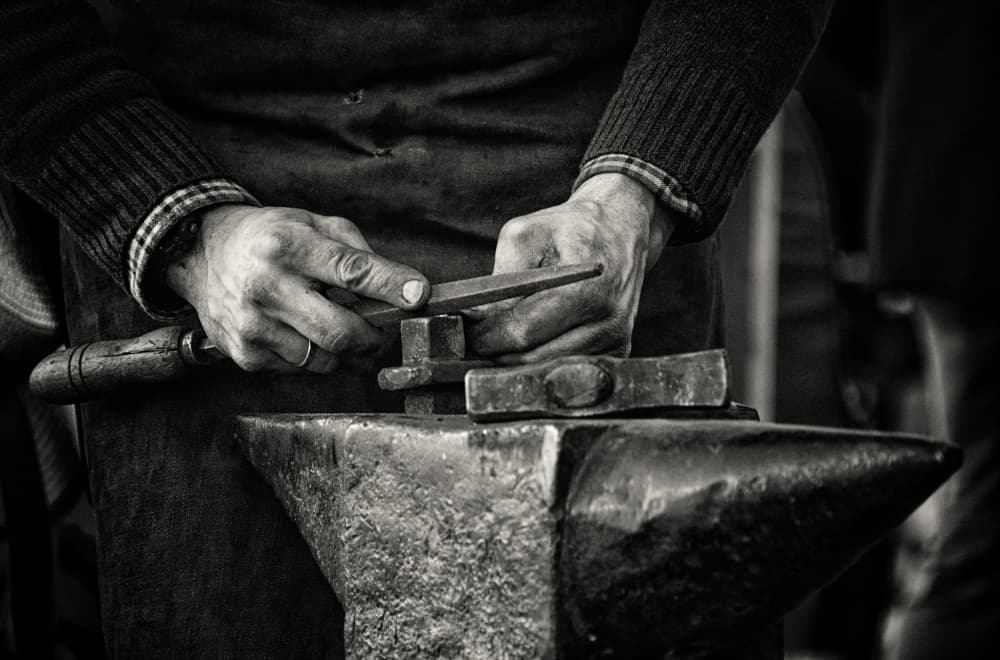 Blacksmith Working Hands by Yiannis Logiotatides — canvas wall art