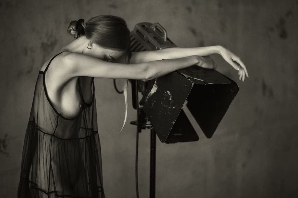 Pensive Woman Studio Light by Chris Bos — canvas wall art