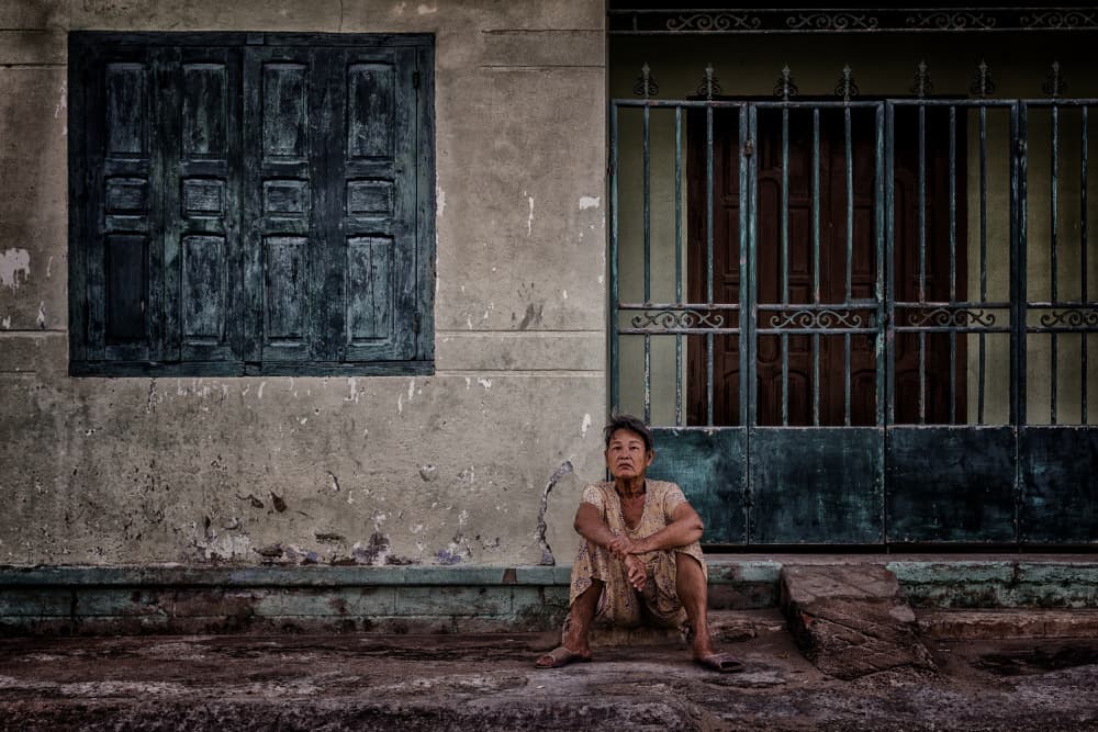 Aged Woman on City Street by Pavol Stranak — canvas wall art