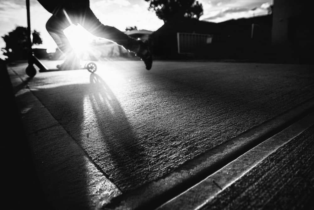 Sunlit Scooter Ride by Despird Zhang — canvas wall art