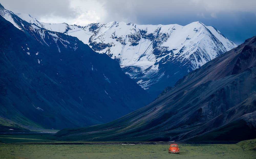 Orange Car Mountain Valley by Robert Zhang — canvas wall art