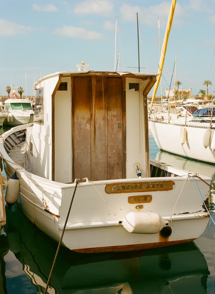 Rustic Harbor Boat by Bethany Young — canvas wall art