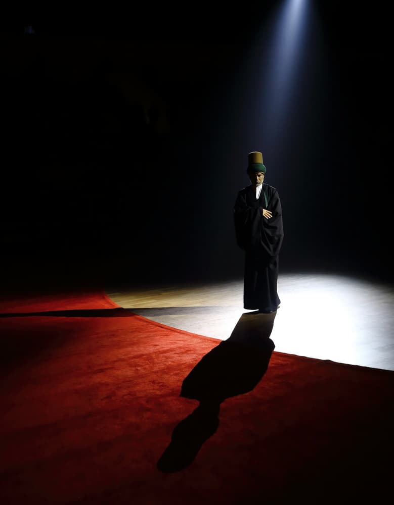 Sufi Dervish in Spotlight by Mustafa Binol — canvas wall art
