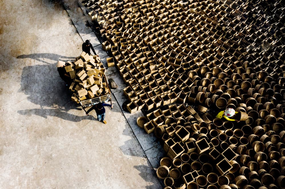 Workers Among Woven Baskets by Tran Van Truong — canvas wall art