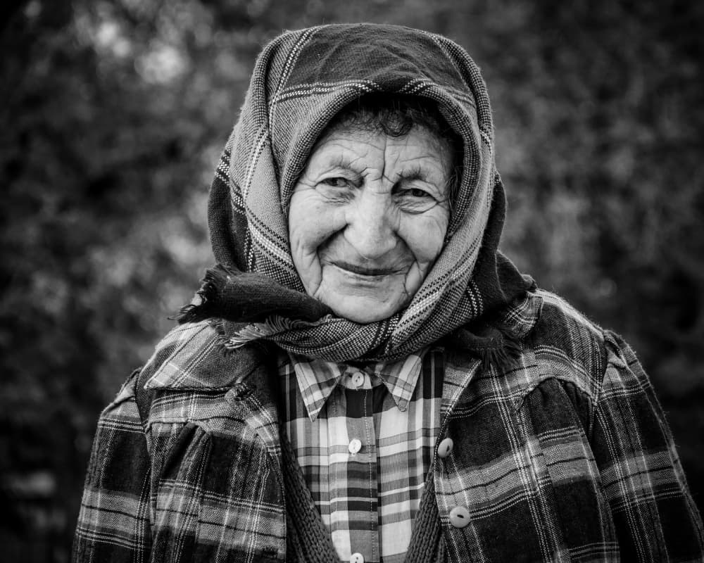 Elder Woman's Kind Smile by Heike Wolters-Wrase — canvas wall art