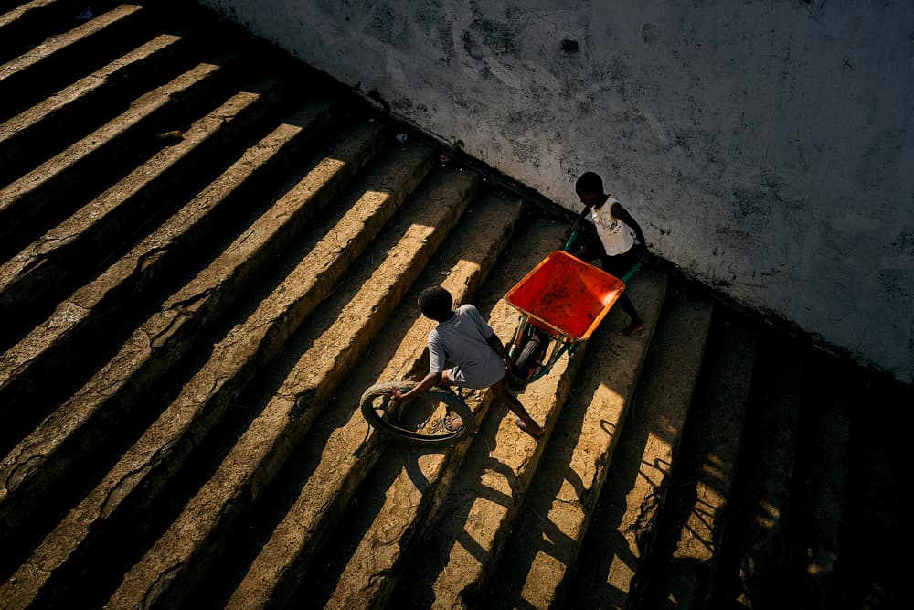Boys on Sunny Steps by Luís Godinho — canvas wall art