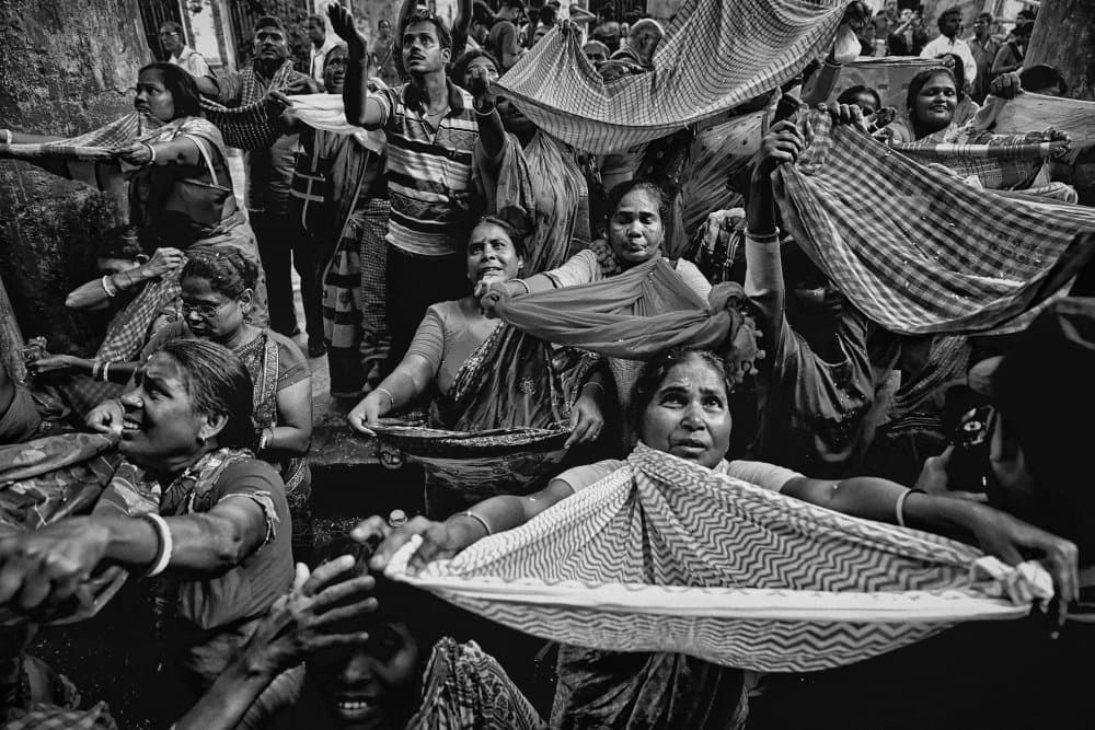 Gathering Fabric Hands by Shaibal Nandi — canvas wall art