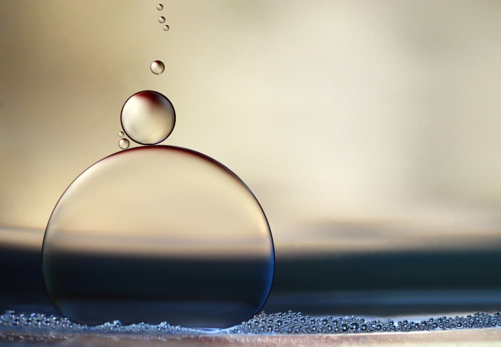 Golden Liquid Drops by Heidi Westum — canvas wall art